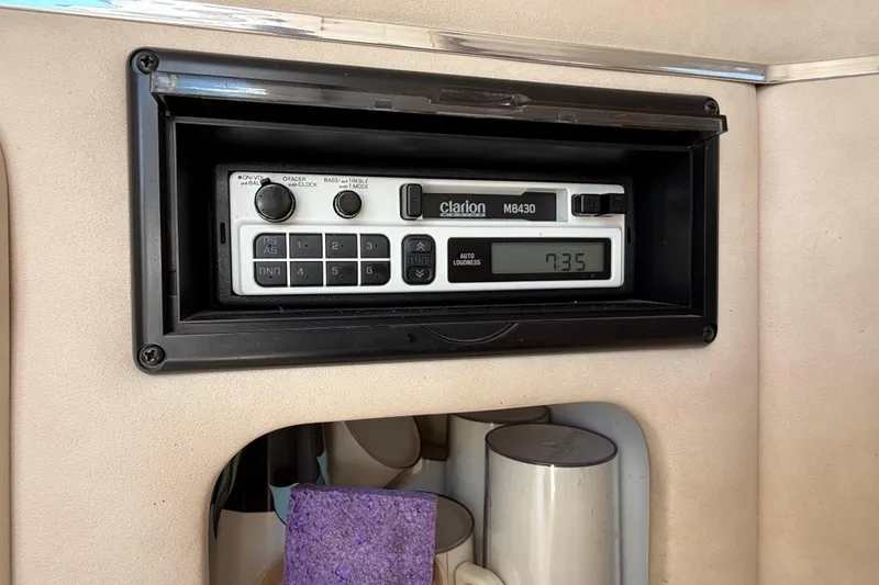 Slide: The Image of Clarion M8430 radio installed in a 1996 Sea Ray 250 Sundancer boat interior. - 26
