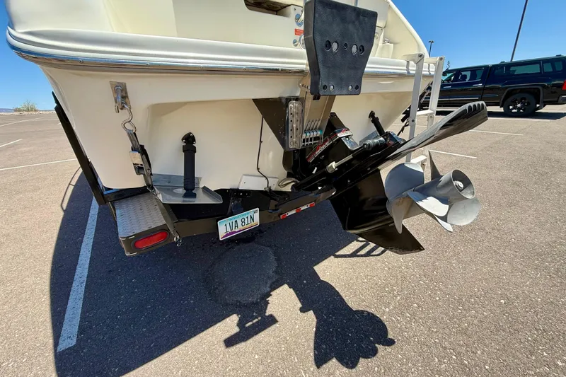 Slide: The Image of Rear view of a 1996 Sea Ray 250 Sundancer boat with visible propeller and license plate. - 6