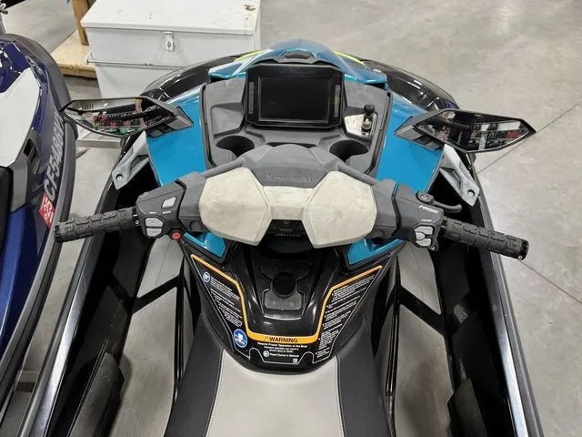 Slide: The Image of Kawasaki Ultra 2022 Jet Ski cockpit with handlebars and display. - 11