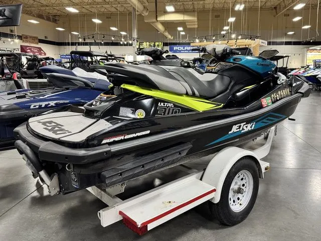 Slide: The Image of Kawasaki Ultra 2022 Jet Ski on trailer in showroom. - 3