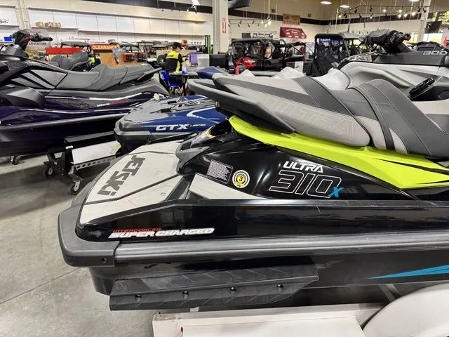 Slide: The Image of 2022 Kawasaki Ultra 310X jetski in showroom. - 6