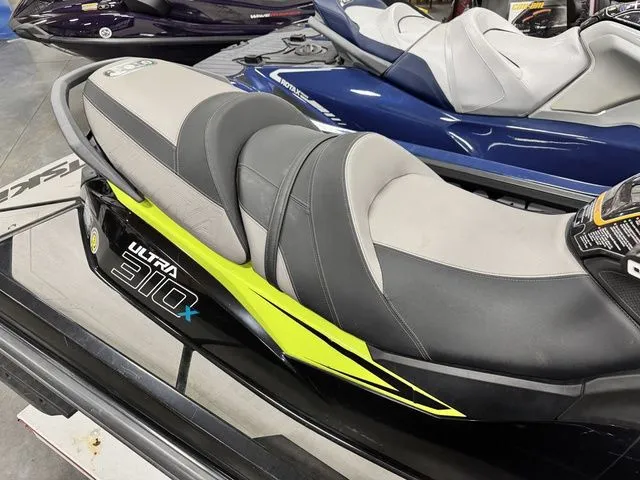 Slide: The Image of Kawasaki Ultra 310X jet ski seat, 2022 model, displayed in showroom. - 7