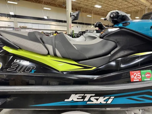 Slide: The Image of Kawasaki Ultra 2022 Jet Ski displayed in showroom. - 8