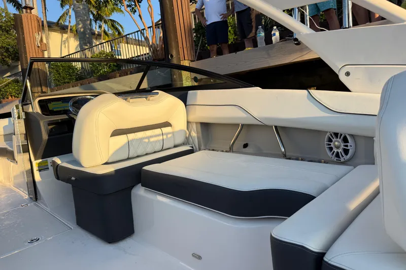 Slide: The Image of 2024 Regal LX2 boat interior with luxurious white seating and modern design. - 11
