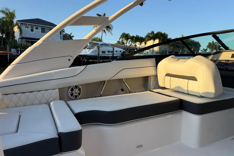Slide: The Image of 2024 Regal LX2 boat interior with luxurious seating and modern design. - 12