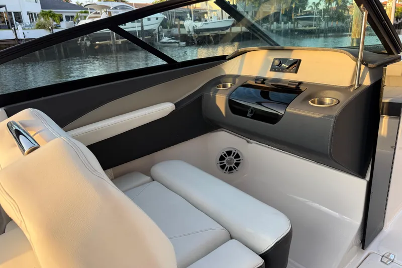 Slide: The Image of 2024 Regal LX2 boat interior with luxurious seating and modern dashboard design. - 14