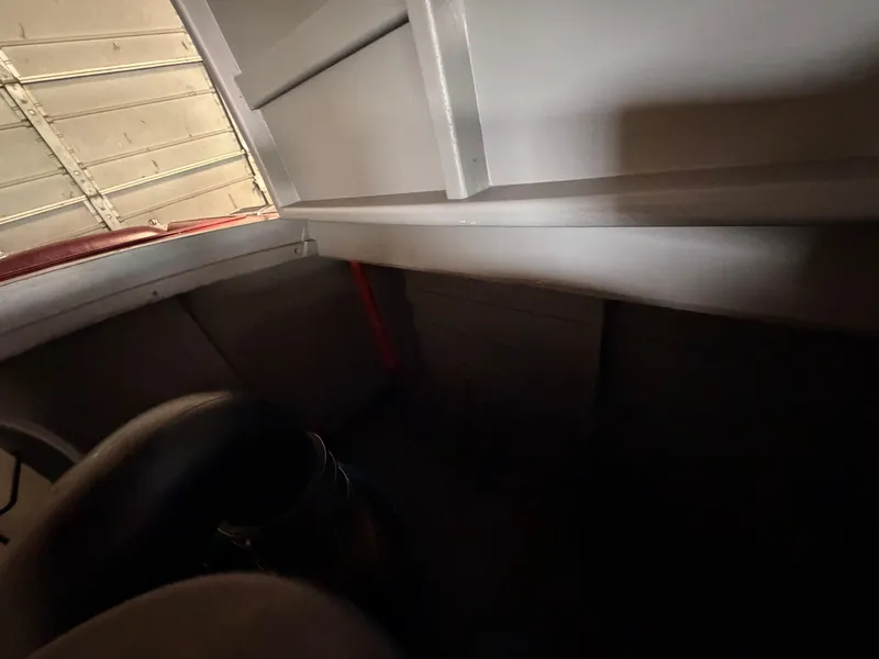 Slide: The Image of Interior of a 1933 Chris-Craft Deluxe 302, featuring dark and light wood tones. - 48