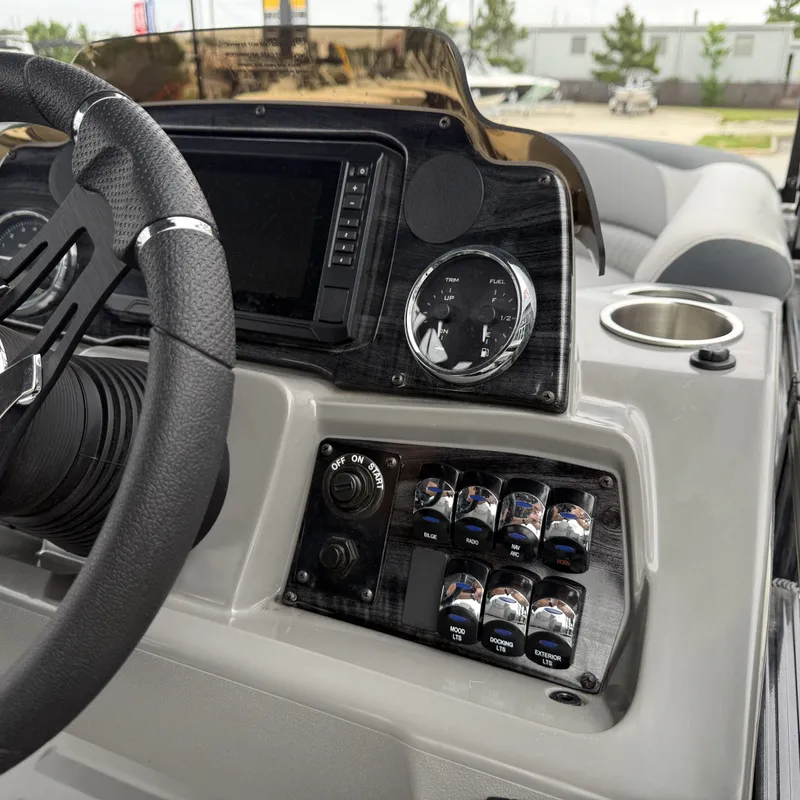 Slide: The Image of Dashboard of Avalon Venture 85 Quad Lounge 2025 with controls and gauges. - 20
