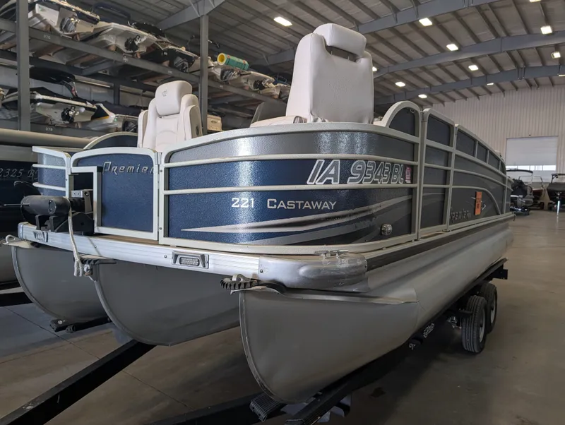 Slide: The Image of 2013 Premier 221 Castaway pontoon boat in storage facility. - 14