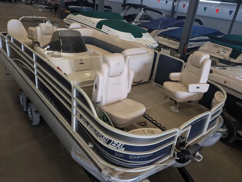 Slide: The Image of 2013 Premier 221 Castaway RE pontoon boat indoors. - 16