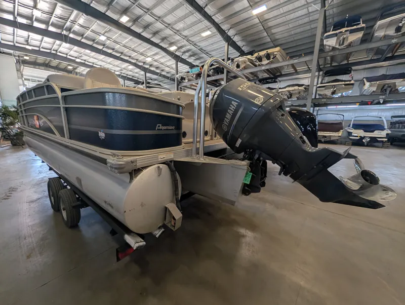 Slide: The Image of 2013 Premier 221 Castaway RE pontoon boat in storage facility. - 4