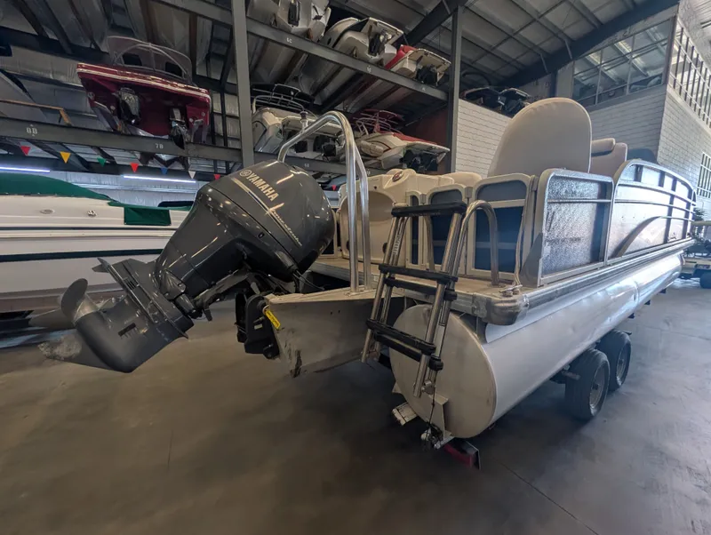 Slide: The Image of 2013 Premier 221 Castaway RE pontoon boat with Yamaha outboard motor. - 5