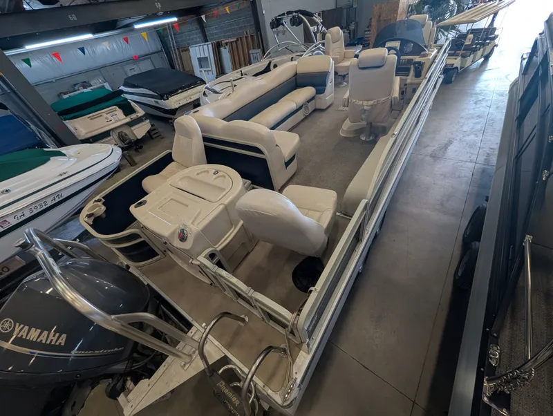 Slide: The Image of 2013 Premier 221 Castaway RE pontoon boat in storage. - 6