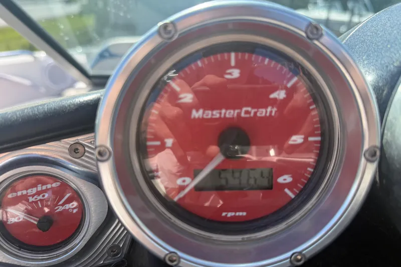 Slide: The Image of Close-up of 2006 MasterCraft X-15 boat tachometer and engine temperature gauge. - 10