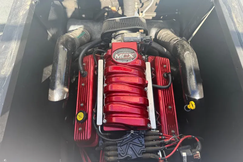 Slide: The Image of 2006 MasterCraft X-15 engine with red MCX Vortec cover, detailed view. - 19
