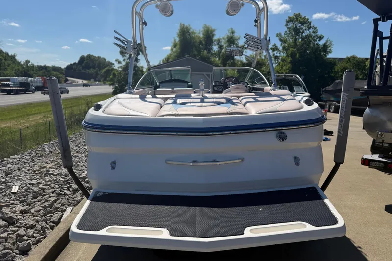 Slide: The Image of 2006 MasterCraft X-15 boat with wakeboard tower, parked on a sunny day. - 22