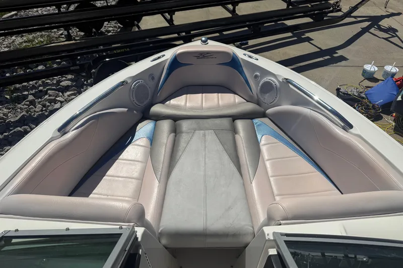 Slide: The Image of 2006 MasterCraft X-15 boat interior with cushioned seating and built-in speakers. - 3