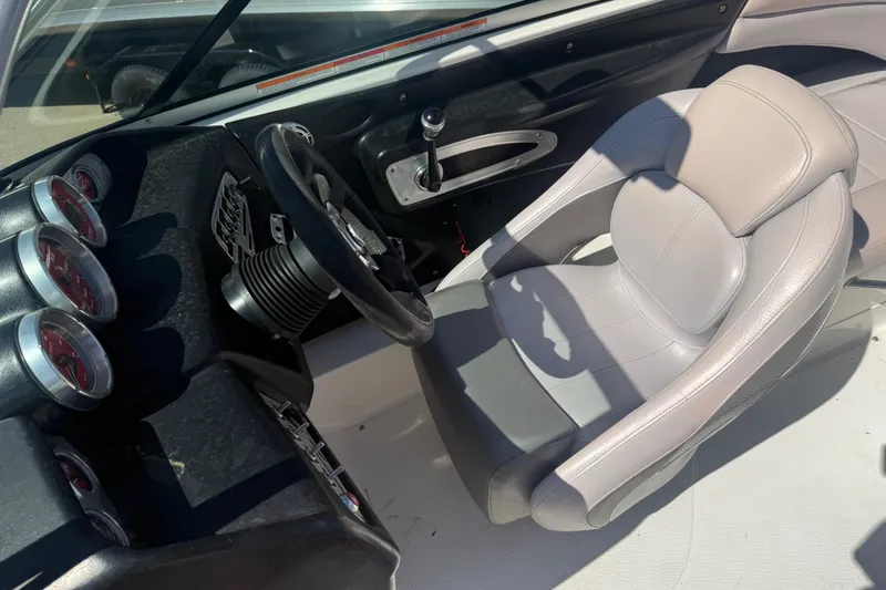 Slide: The Image of 2006 MasterCraft X-15 boat interior with steering wheel and gauges. - 5