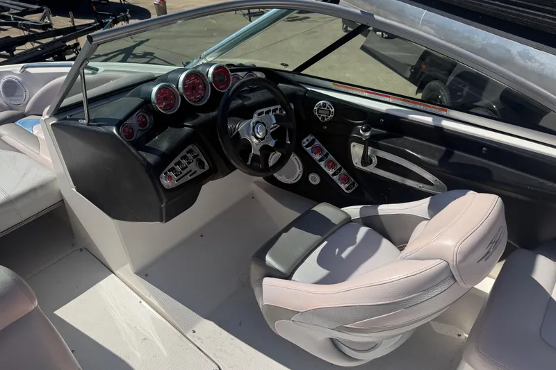 Slide: The Image of 2006 MasterCraft X-15 boat interior with steering wheel and dashboard controls. - 8