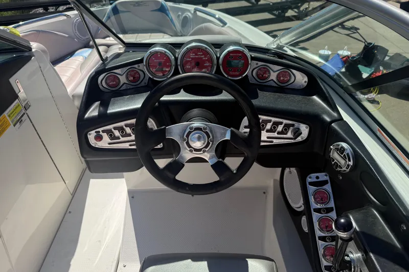Slide: The Image of 2006 MasterCraft X-15 boat dashboard with steering wheel and gauges. - 9
