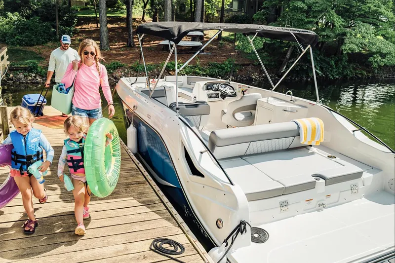 The Image of Manufacturer Provided Image: Family enjoying a day on a 2025 Bayliner D22I boat at a lakeside dock. - 0