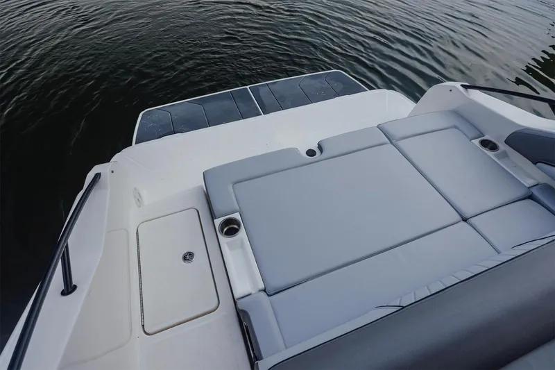 Slide: The Image of Manufacturer Provided Image: 2025 Bayliner D22I boat with spacious rear seating and swim platform on calm water. - 6