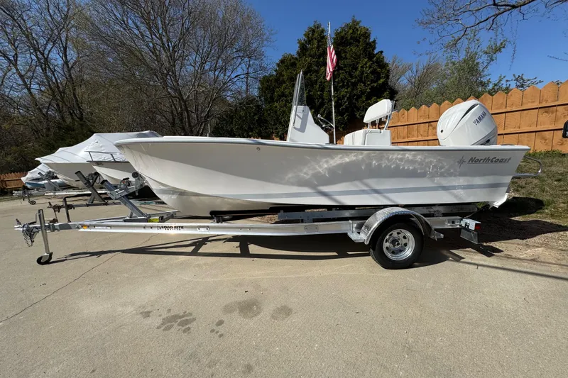 The Image of 2026 NorthCoast 190 Center Console boat on trailer outdoors. - 0