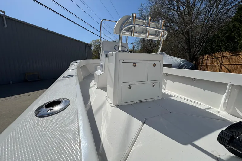 Slide: The Image of NorthCoast 190 Center Console boat, 2026 model, parked outdoors. - 9