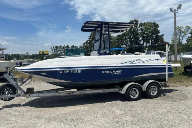 The Image of 2011 Starcraft Star Step 229 CC OB boat on trailer, parked outdoors. - 0