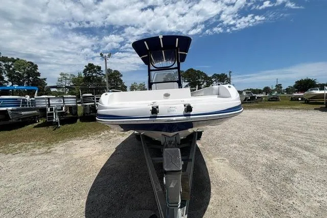 Slide: The Image of 2011 Starcraft Star Step 229 CC OB boat on trailer under blue sky. - 1