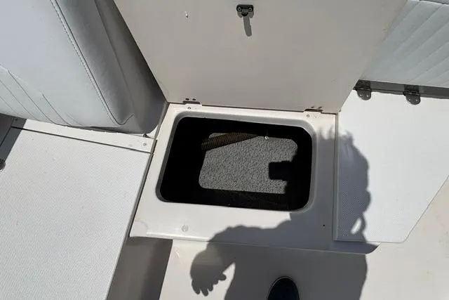 Slide: The Image of Open storage compartment on 2011 Starcraft Star Step 229 CC OB boat deck. - 11