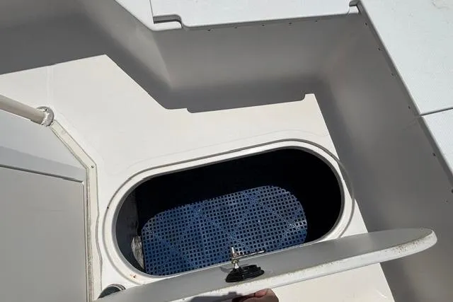 Slide: The Image of Open storage compartment on 2011 Starcraft Star Step 229 CC OB boat. - 13