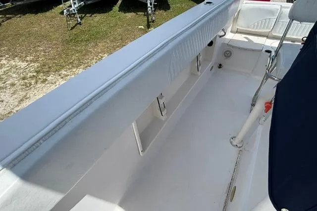 Slide: The Image of 2011 Starcraft Star Step 229 CC OB boat interior with seating and storage compartments. - 14