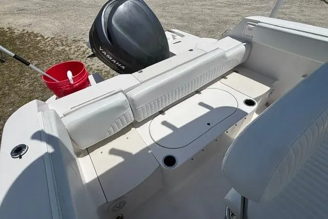 Slide: The Image of 2011 Starcraft Star Step 229 CC OB boat interior with Yamaha outboard motor and seating area. - 16