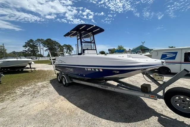 Slide: The Image of 2011 Starcraft Star Step 229 CC OB boat on trailer under clear sky. - 2