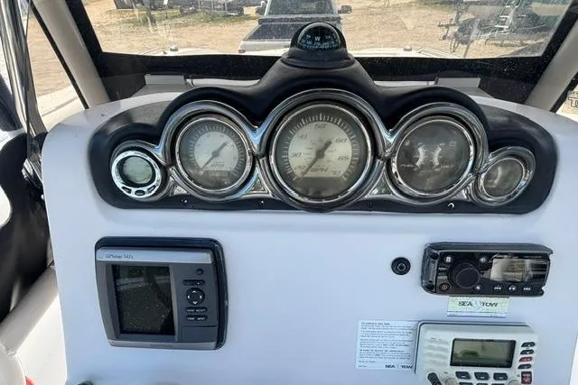 Slide: The Image of Dashboard of 2011 Starcraft Star Step 229 CC OB boat with gauges and navigation equipment. - 21