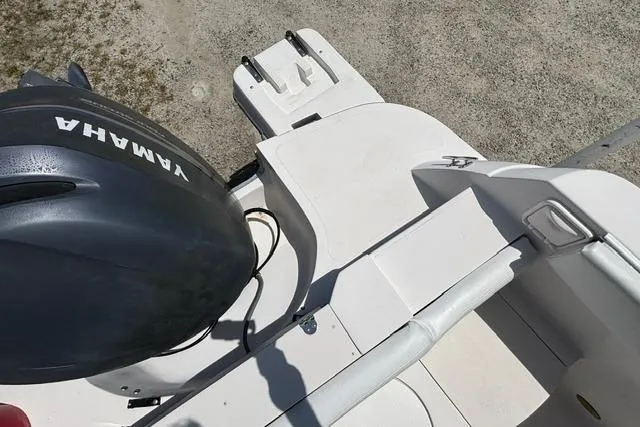 Slide: The Image of 2011 Starcraft Star Step 229 CC OB boat with Yamaha outboard motor, viewed from above. - 24