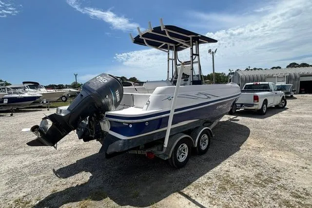 Slide: The Image of 2011 Starcraft Star Step 229 CC OB boat on trailer, parked outdoors under clear sky. - 4