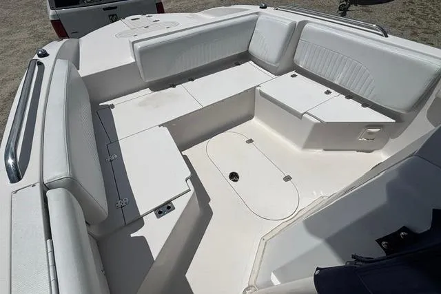 Slide: The Image of 2011 Starcraft Star Step 229 CC OB boat interior with spacious seating and storage compartments. - 6