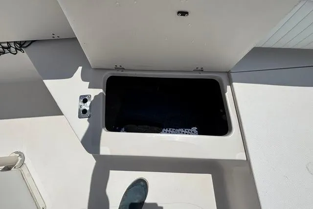 Slide: The Image of 2011 Starcraft Star Step 229 CC OB boat storage compartment, open and empty. - 9