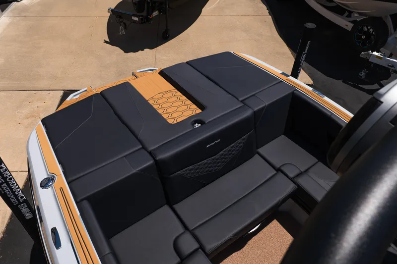 Slide: The Image of 2026 MasterCraft NXT24 boat interior with sleek black seating and stylish design. - 14
