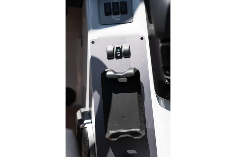 Slide: The Image of Control panel of 2026 MasterCraft NXT24 boat with wireless charging pad. - 22