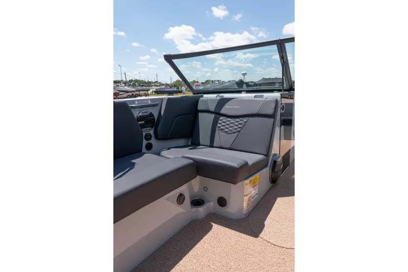 Slide: The Image of 2026 MasterCraft NXT24 boat interior with sleek seating and modern design. - 24