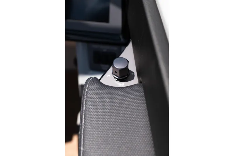 Slide: The Image of Close-up of 2026 MasterCraft NXT24 boat control knob and textured surface. - 25