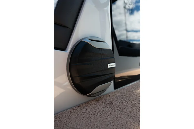 Slide: The Image of 2026 MasterCraft NXT24 boat speaker detail with Meridian branding. - 26