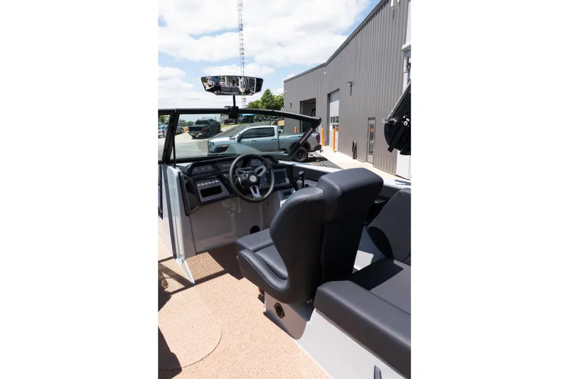 Slide: The Image of Interior view of 2026 MasterCraft NXT24 boat, featuring sleek dashboard and comfortable seating. - 27