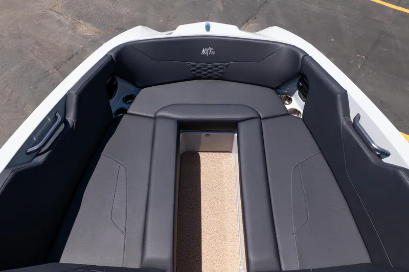 Slide: The Image of 2026 MasterCraft NXT24 boat interior with sleek seating and modern design. - 28