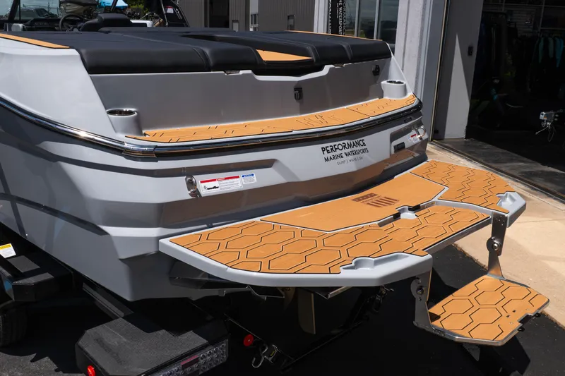 Slide: The Image of 2026 MasterCraft NXT24 boat with teak-style swim platform and sleek design. - 5