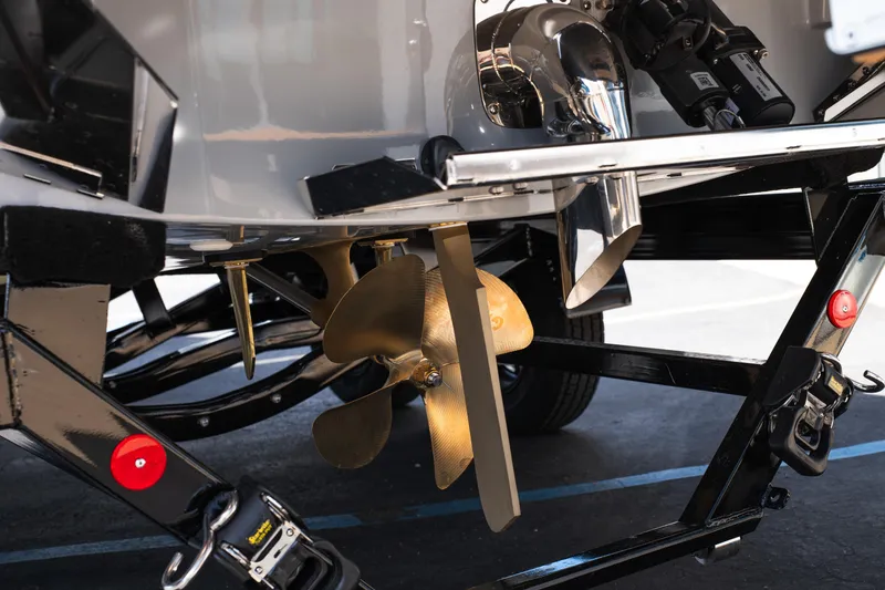 Slide: The Image of Close-up of 2026 MasterCraft NXT24 boat propeller and trailer components. - 6