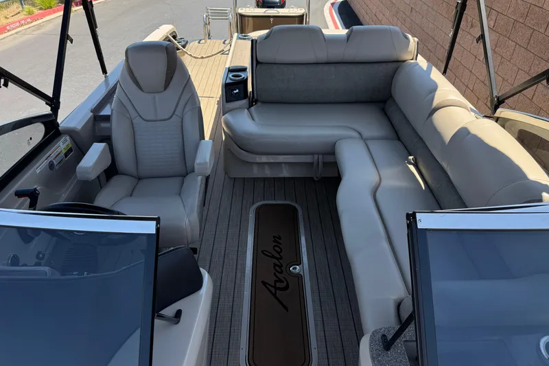 Slide: The Image of 2023 Avalon Catalina VRBW boat interior with plush seating and modern design. - 14
